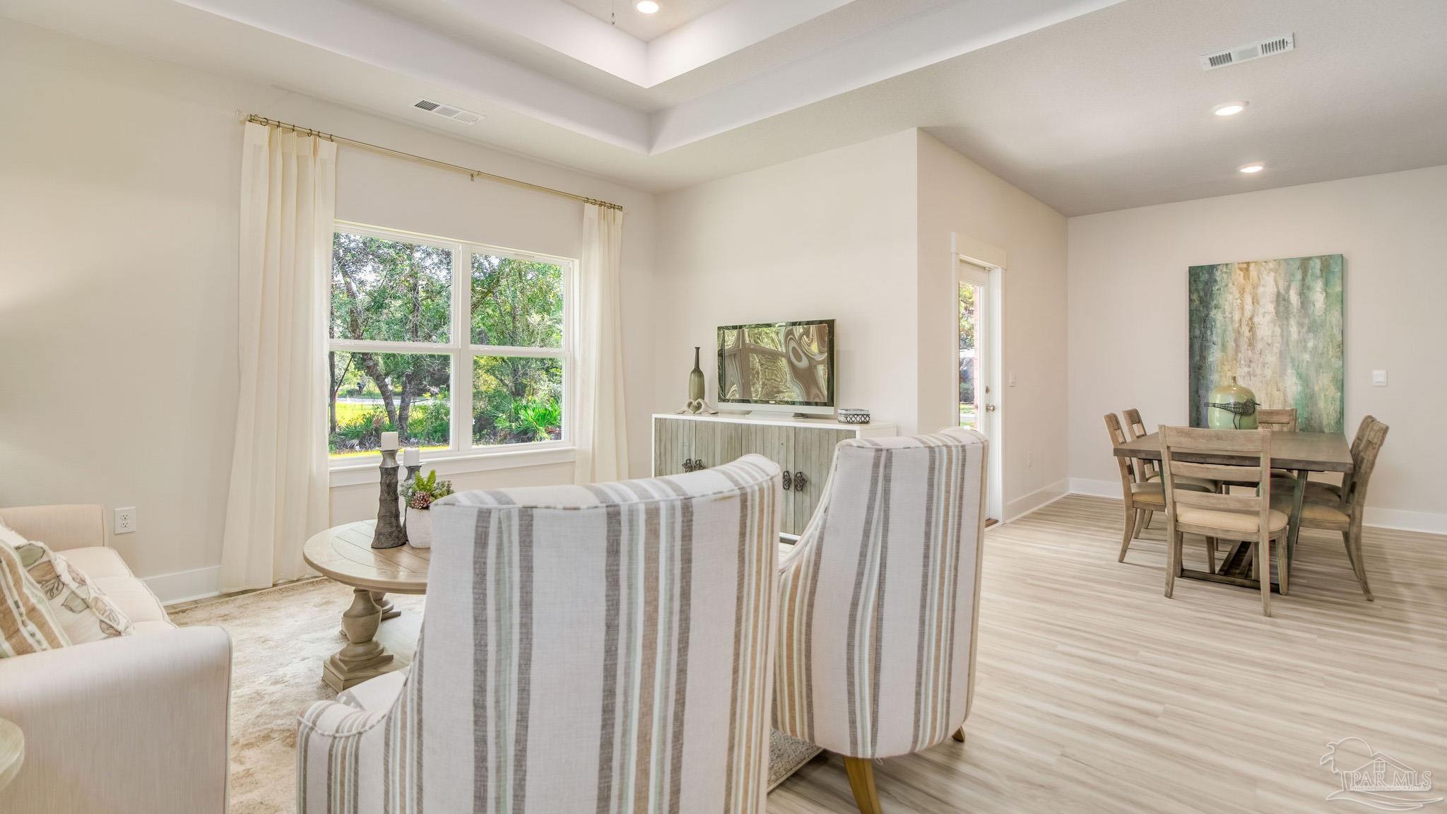 5829 Dove Nest Road Gulf Breeze, FL 32563 - Photo 13 of 31 a living room with furniture and a wooden floor