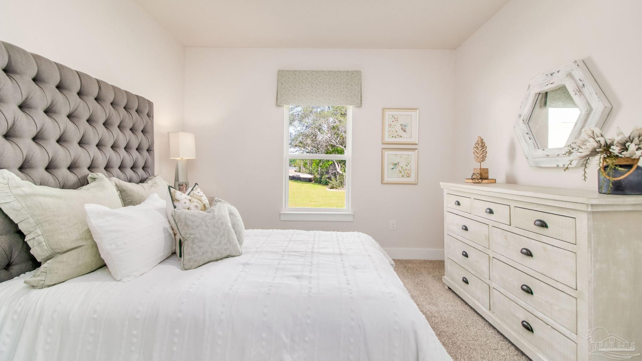 5829 Dove Nest Road Gulf Breeze, FL 32563 - Photo 25 of 31 a bedroom with a bed and a dresser