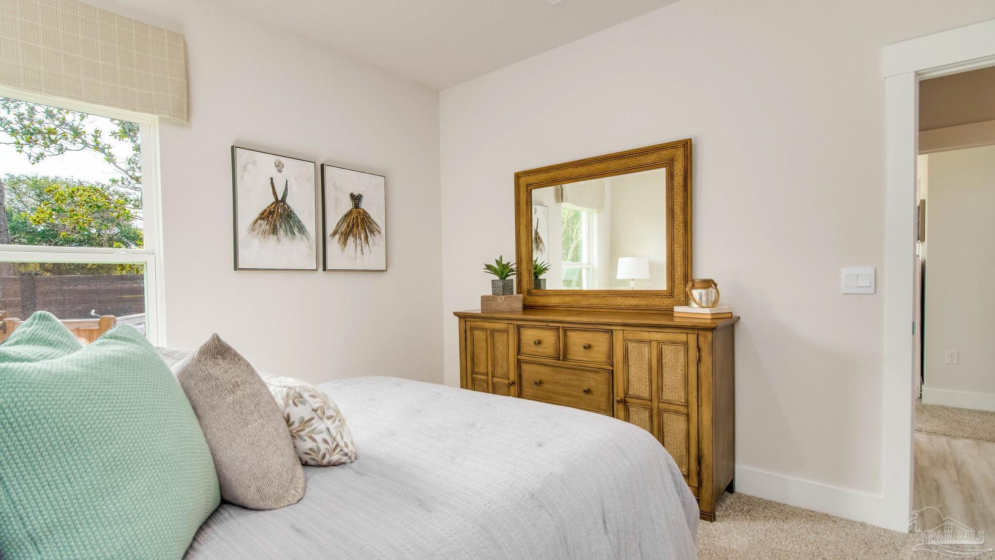 5829 Dove Nest Road Gulf Breeze, FL 32563 - Photo 31 of 31 a bedroom with a bed and a window