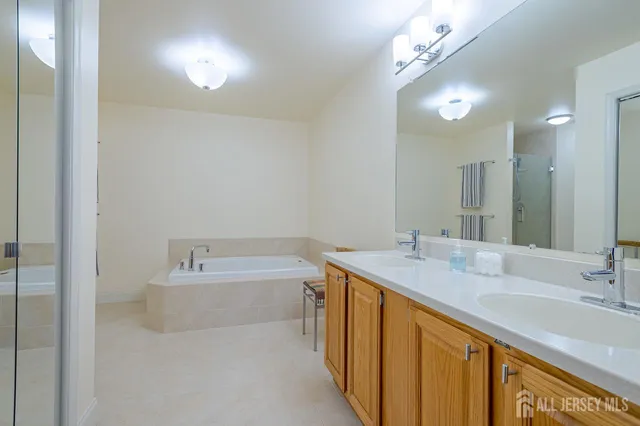 a white bath tub sitting next to a shower