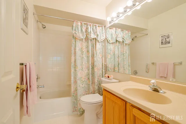 a bedroom with a bed and a potted plant