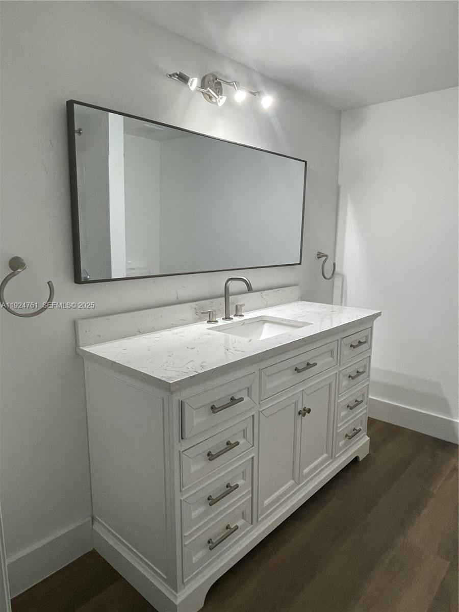410 South Park Road, Unit 207 Hollywood, FL 33021 - Photo 13 of 47 a bathroom with a sink and a mirror