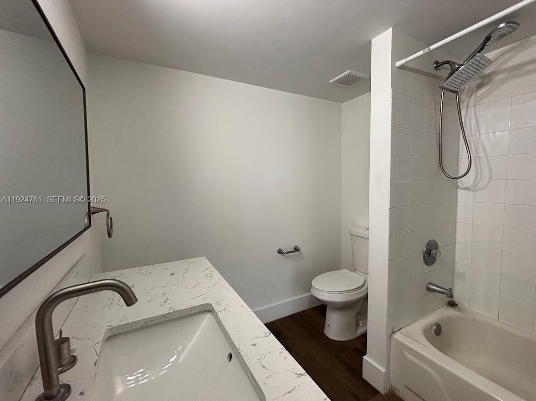 410 South Park Road, Unit 207 Hollywood, FL 33021 - Photo 14 of 47 a bathroom with a sink and toilet