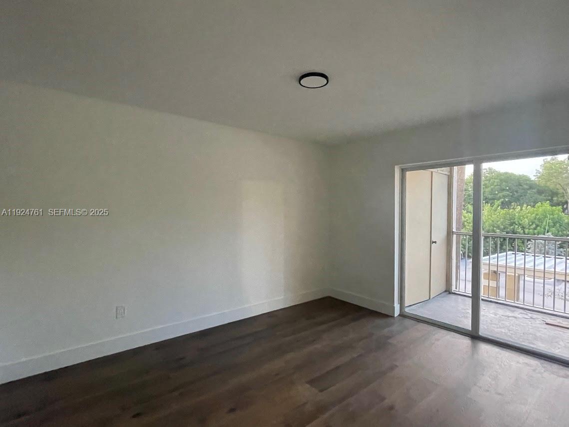 410 South Park Road, Unit 207 Hollywood, FL 33021 - Photo 17 of 47 a view of a livingroom with wooden floor and window