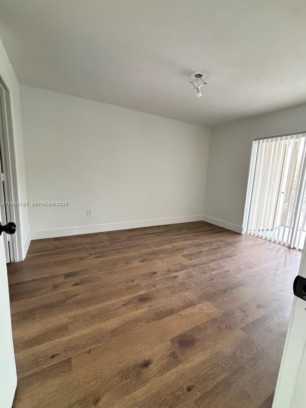 410 South Park Road, Unit 207 Hollywood, FL 33021 - Photo 18 of 47 an empty room with wooden floor and windows