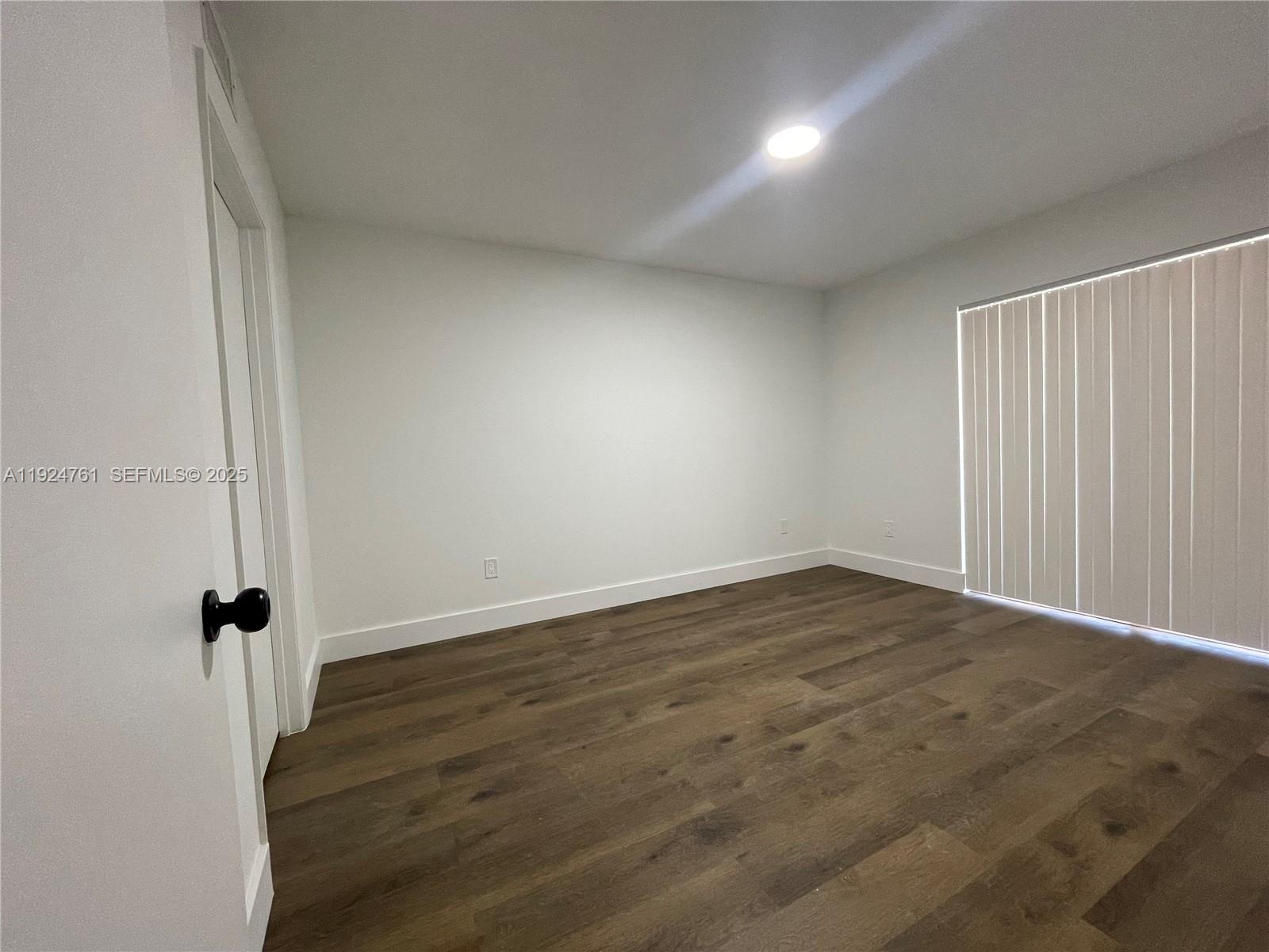 410 South Park Road, Unit 207 Hollywood, FL 33021 - Photo 19 of 47 wooden floor in an empty room