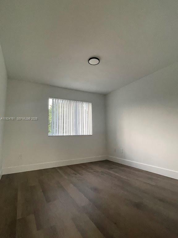 410 South Park Road, Unit 207 Hollywood, FL 33021 - Photo 24 of 47 an empty room with wooden floor and windows