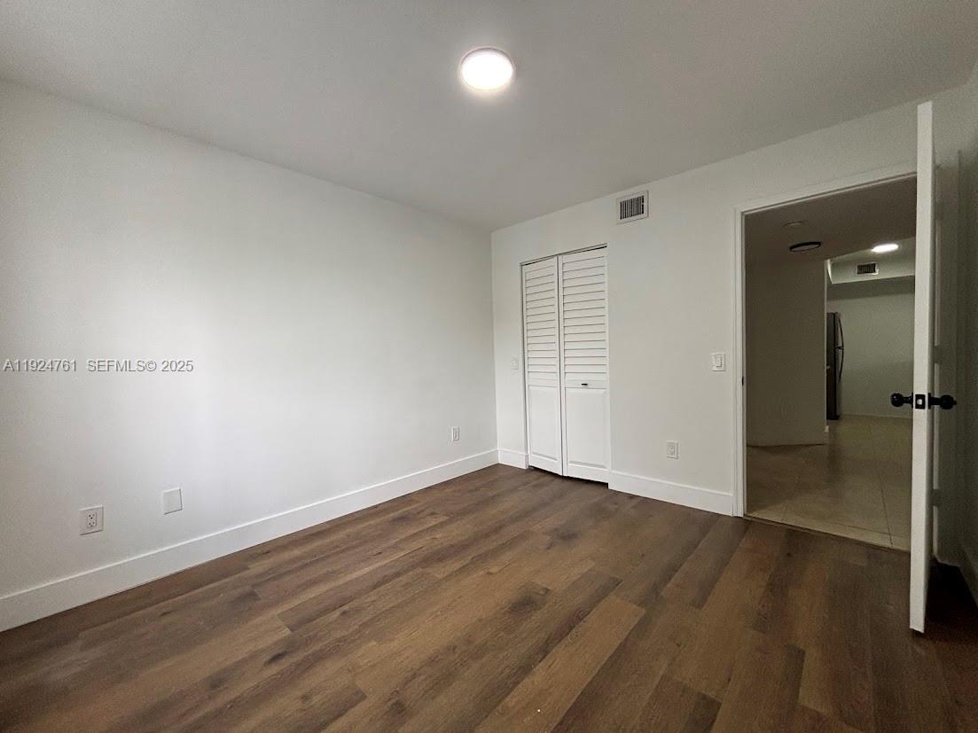 410 South Park Road, Unit 207 Hollywood, FL 33021 - Photo 29 of 47 wooden floor in an empty room