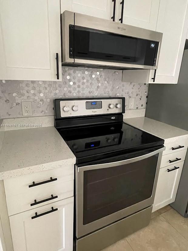 410 South Park Road, Unit 207 Hollywood, FL 33021 - Photo 3 of 47 a stove top oven sitting inside of a kitchen