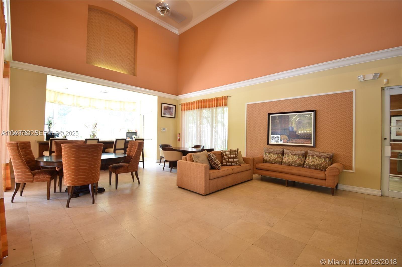 410 South Park Road, Unit 207 Hollywood, FL 33021 - Photo 42 of 47 a living room with furniture and large windows