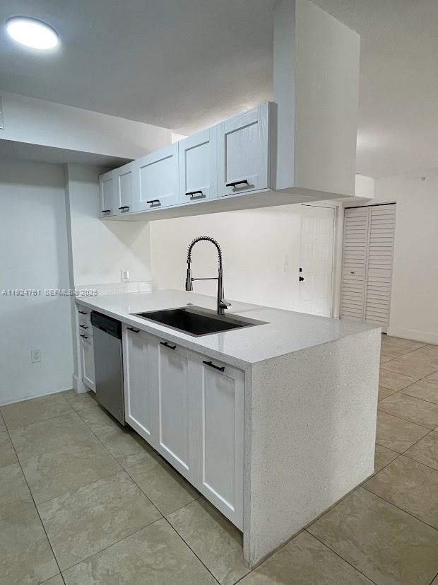410 South Park Road, Unit 207 Hollywood, FL 33021 - Photo 6 of 47 a kitchen with stainless steel appliances a sink a stove and a refrigerator