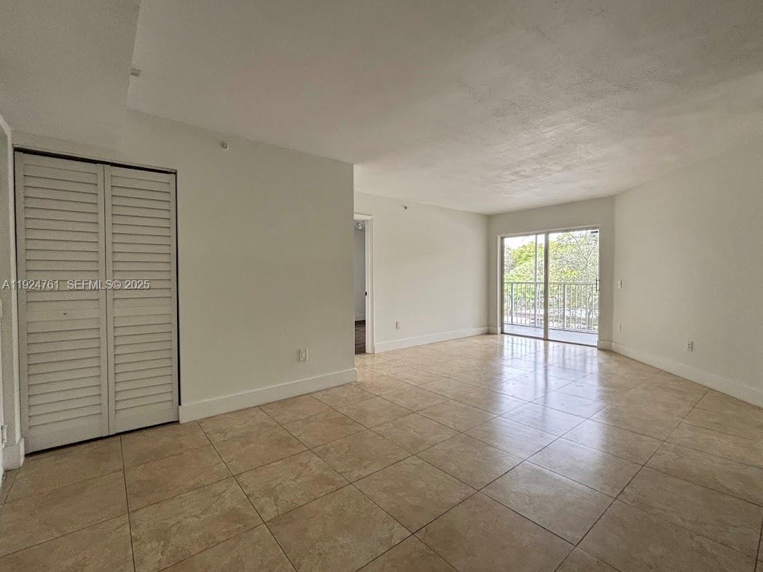 410 South Park Road, Unit 207 Hollywood, FL 33021 - Photo 9 of 47 an empty room with windows