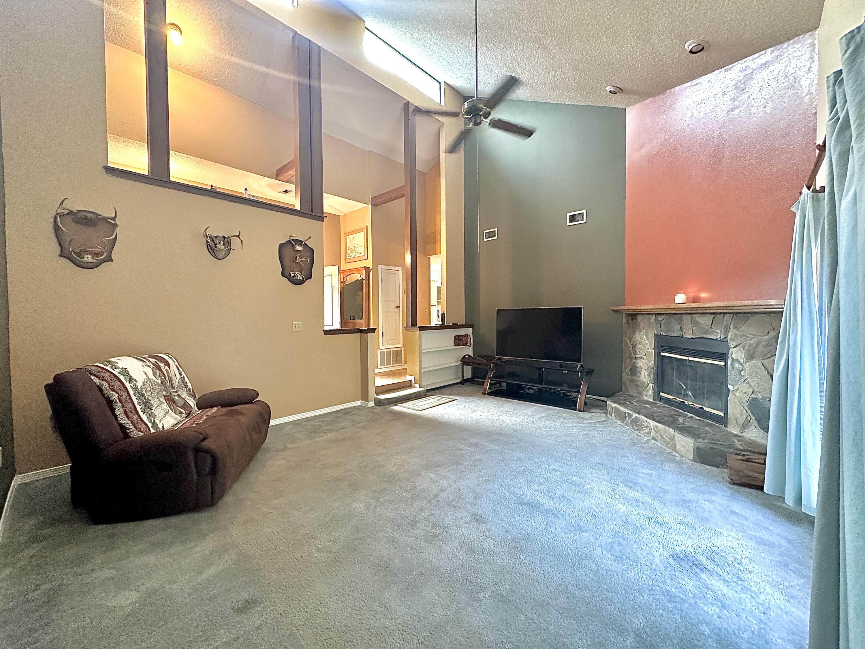 128 Dolphin Cove Freeport, FL 32439 - Photo 11 of 36 a living room with furniture and a fireplace