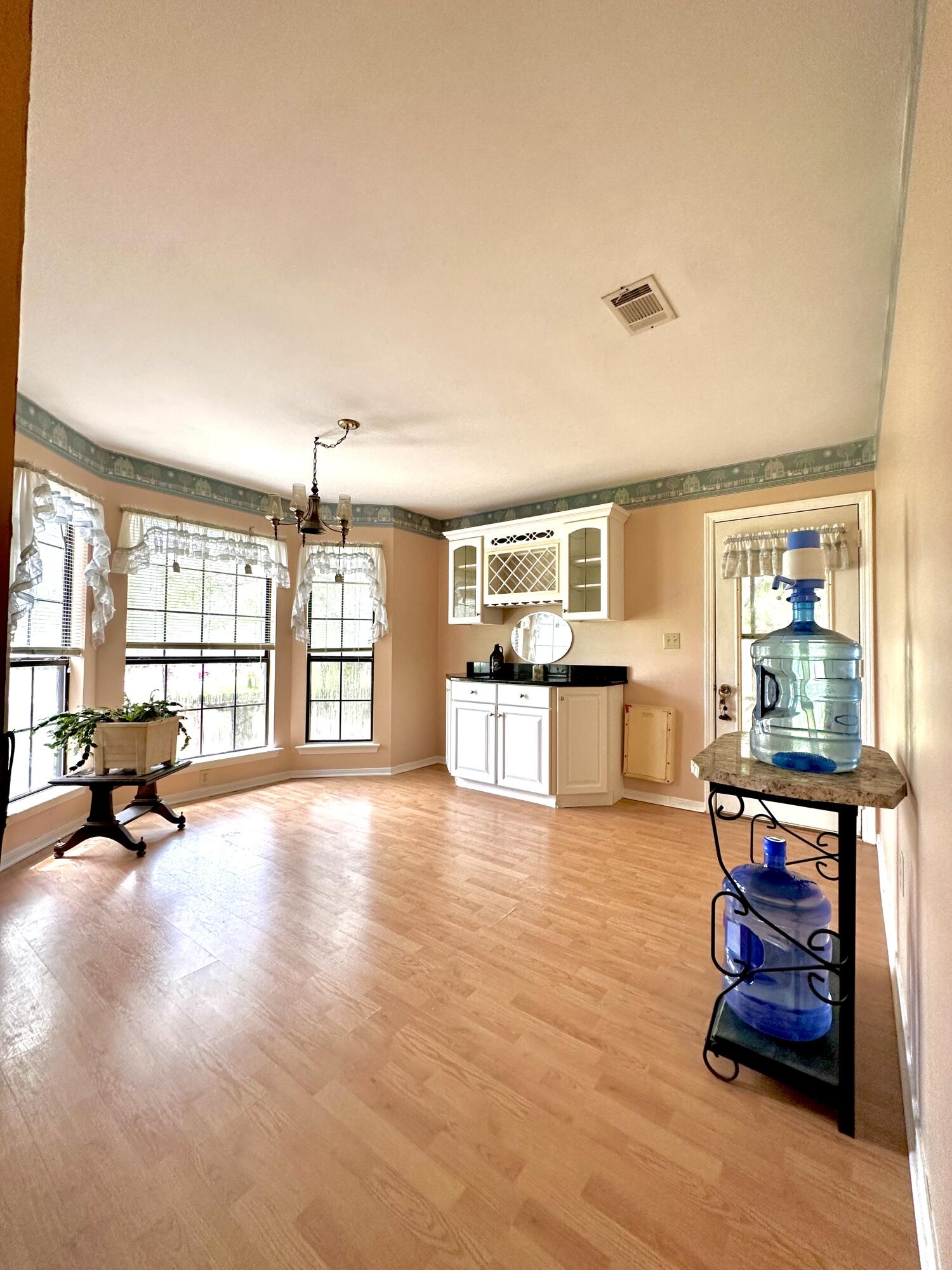 128 Dolphin Cove Freeport, FL 32439 - Photo 16 of 36 a living room with furniture and a wooden floor