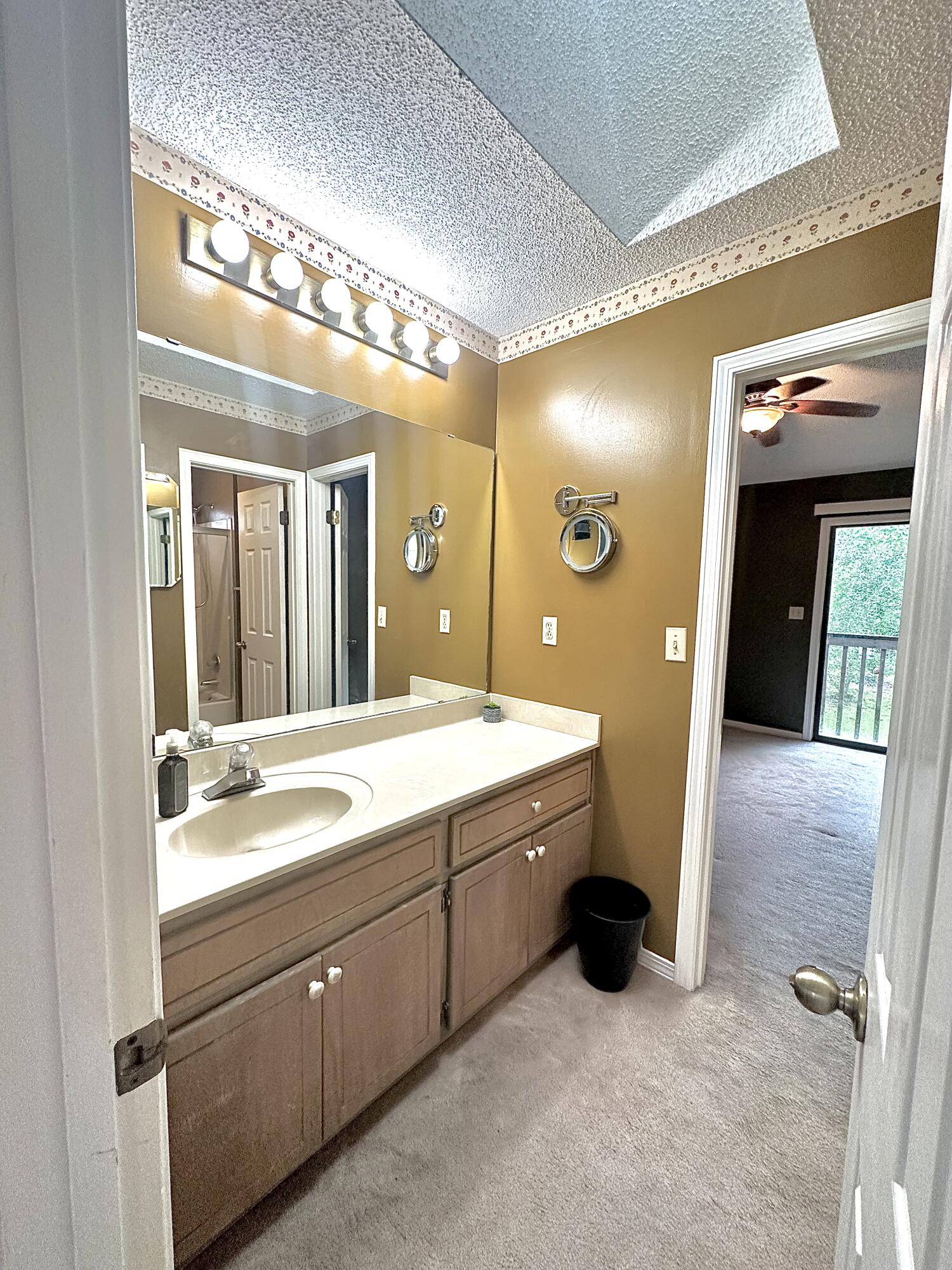 128 Dolphin Cove Freeport, FL 32439 - Photo 23 of 36 a spacious bathroom with a sink and a mirror