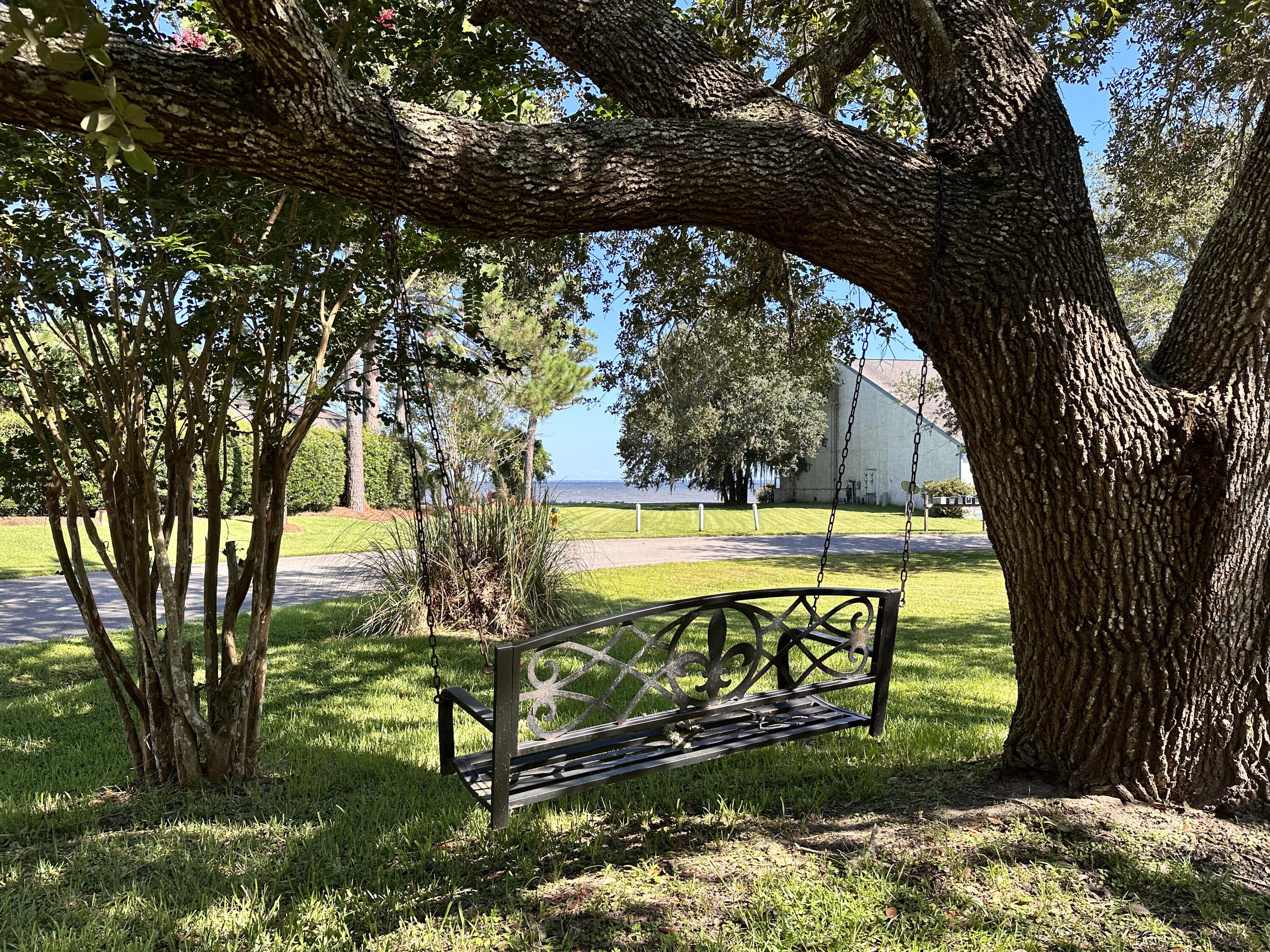128 Dolphin Cove Freeport, FL 32439 - Photo 31 of 36 a view of a yard with a tree