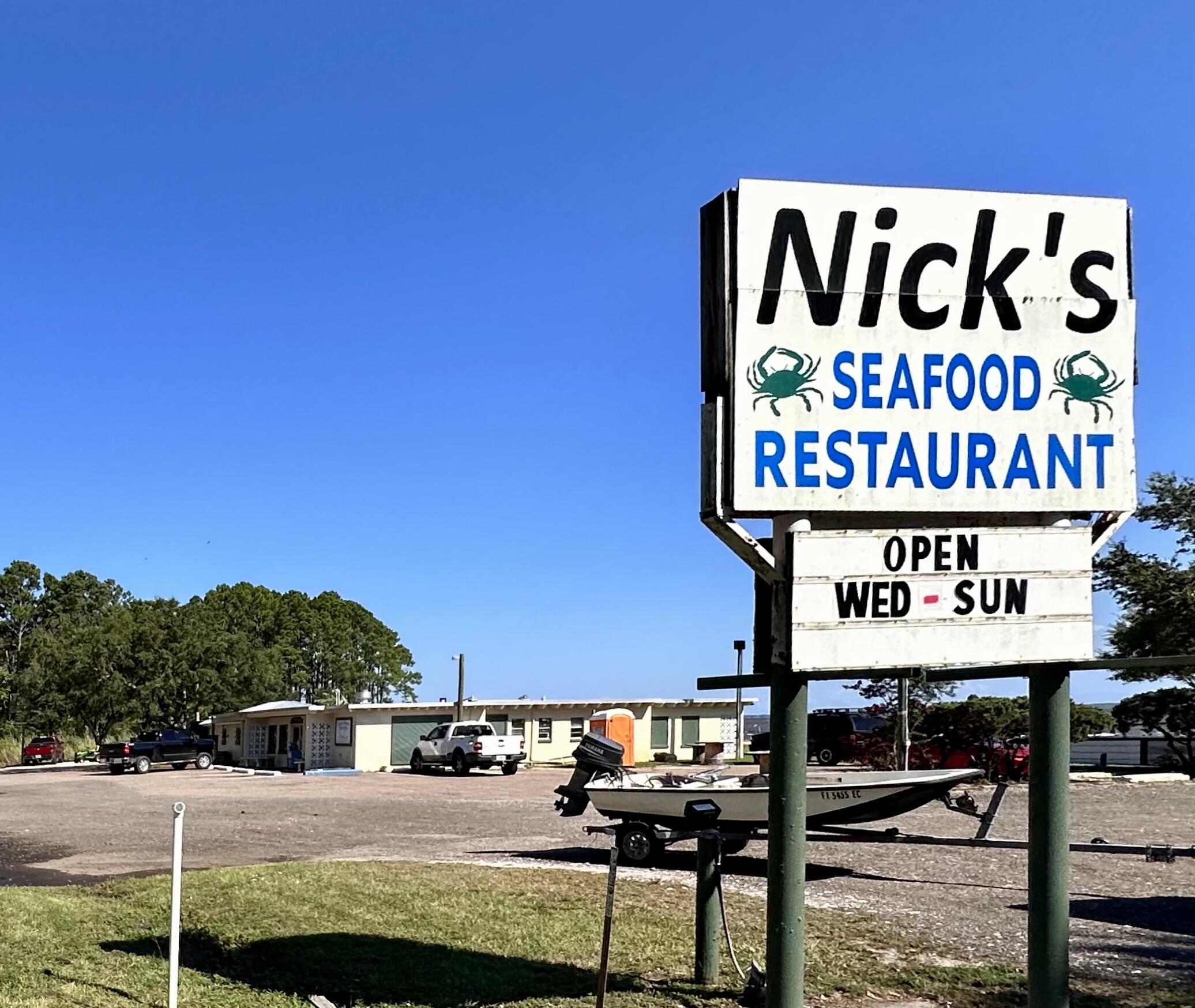 128 Dolphin Cove Freeport, FL 32439 - Photo 32 of 36 a sign on the side of a building