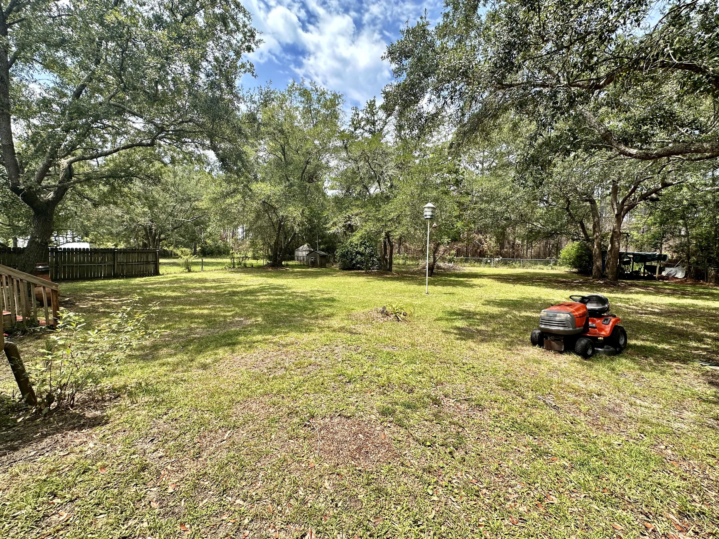 128 Dolphin Cove Freeport, FL 32439 - Photo 7 of 36 a view of a park with large trees
