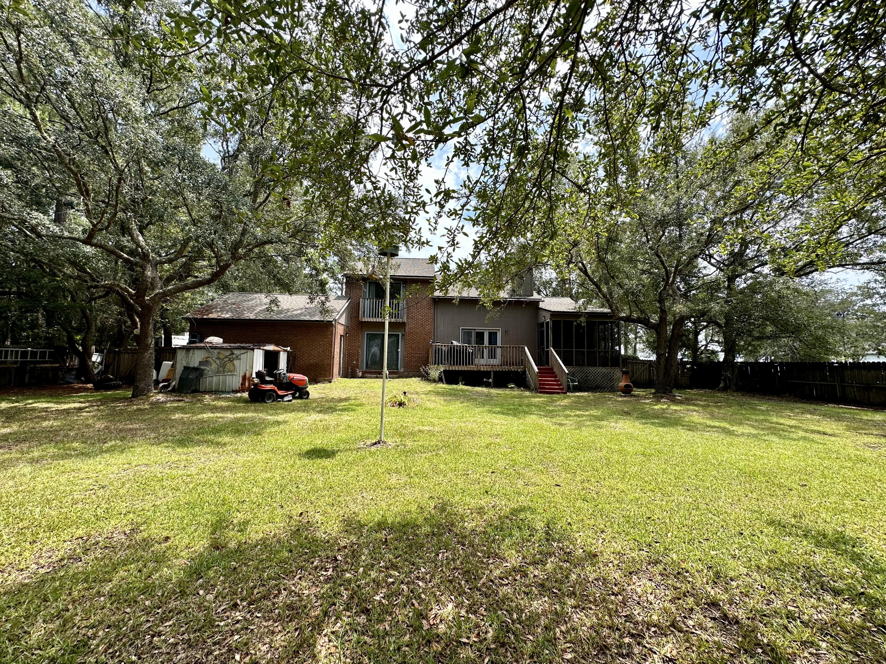 128 Dolphin Cove Freeport, FL 32439 - Photo 8 of 36 a view of a house with swimming pool and sitting area