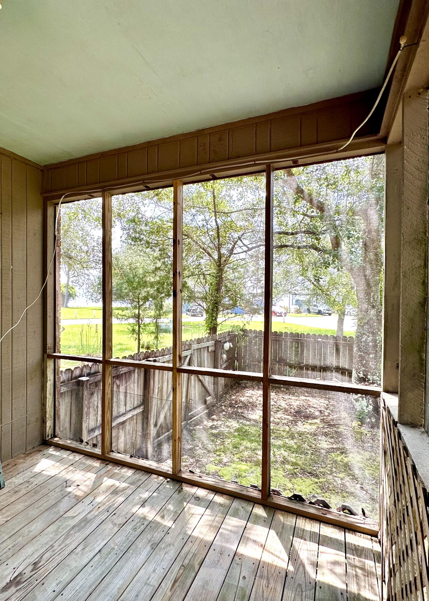 128 Dolphin Cove Freeport, FL 32439 - Photo 10 of 36 a view of a room with wooden floor and windows