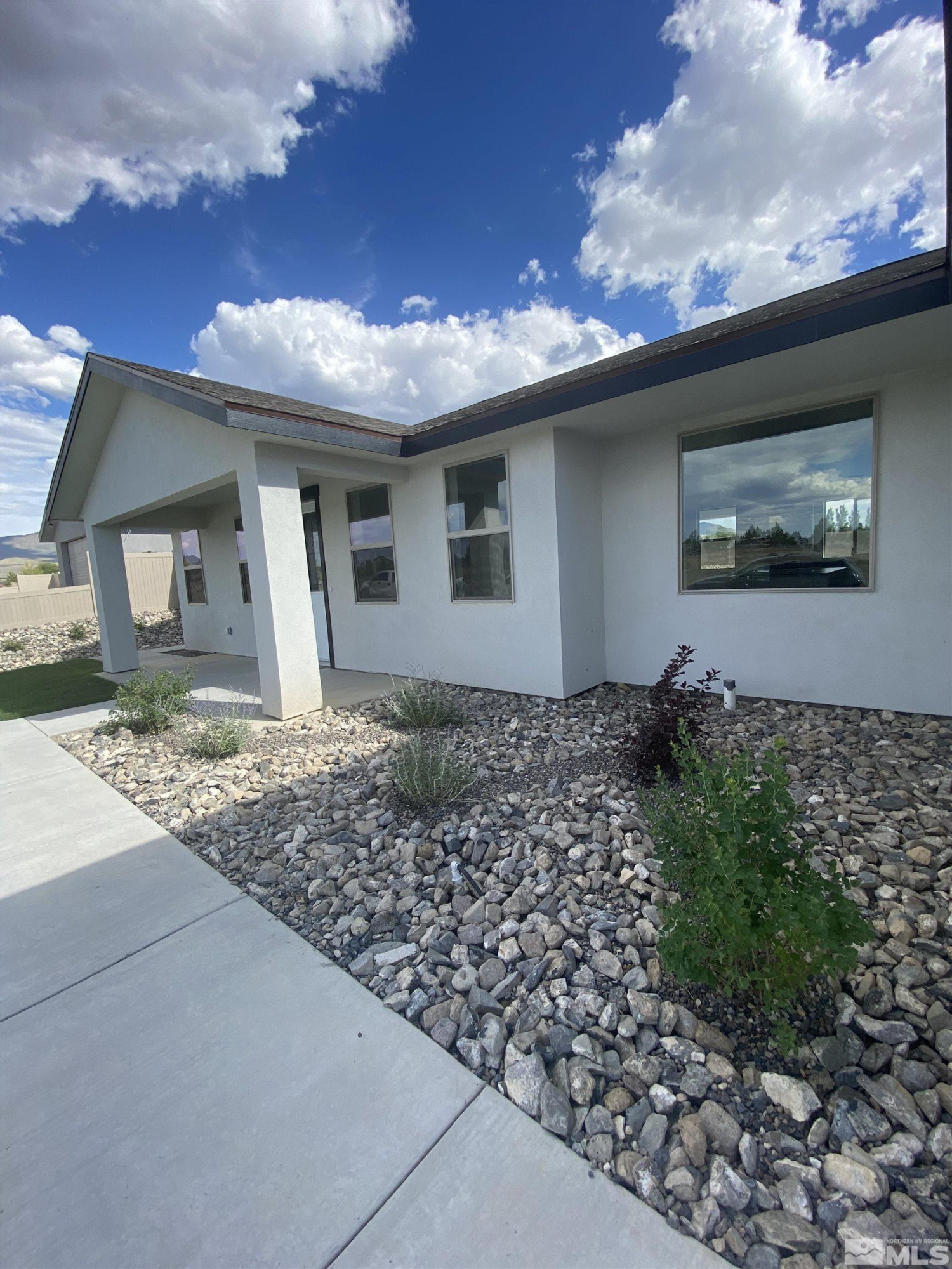 5950 Packsaddle Road Winnemucca, NV 89445 - Photo 13 of 14 a front view of a house with garden
