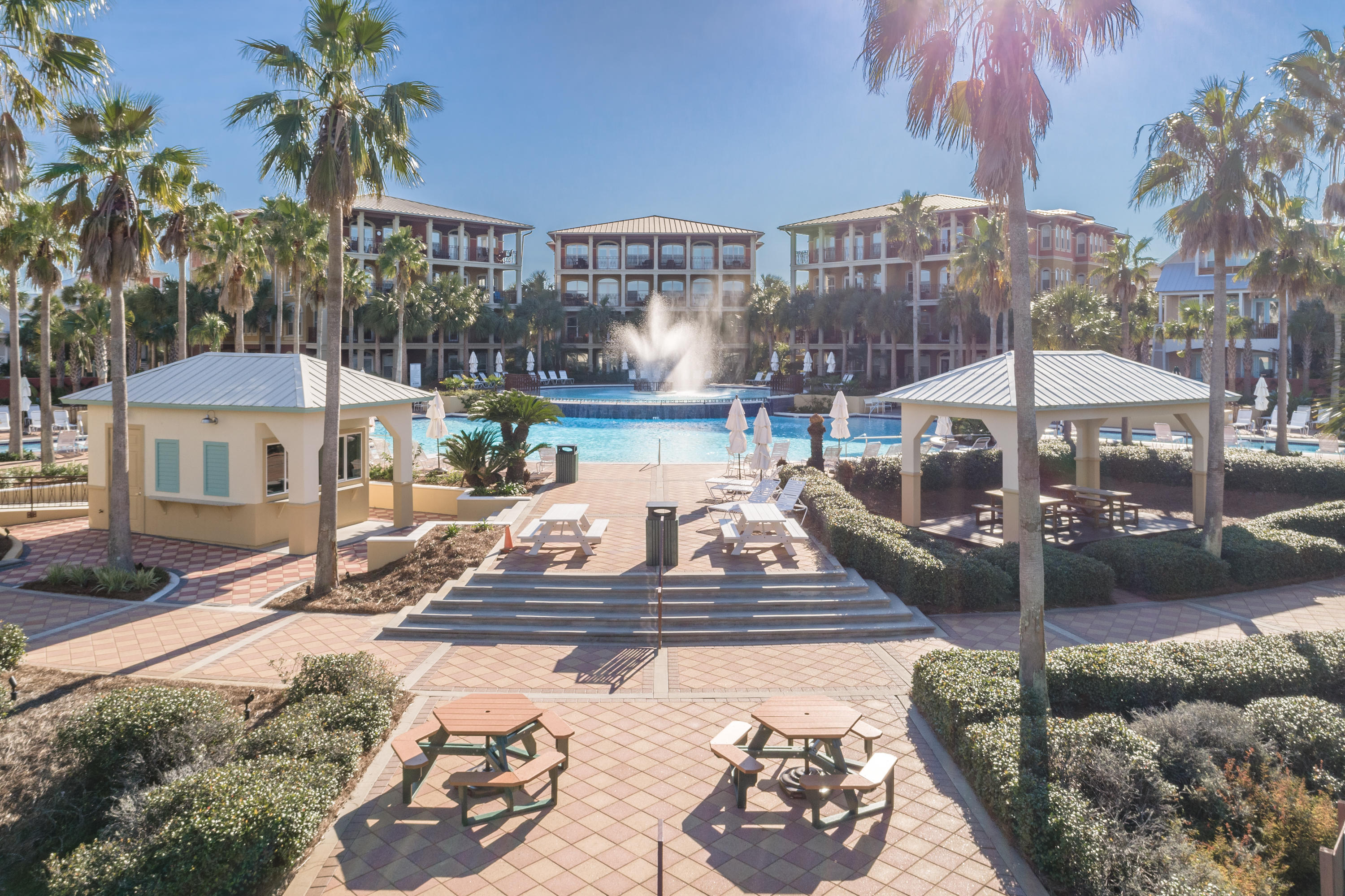 22 Moonlight Beach Lane Inlet Beach, FL 32461 - Photo 40 of 45 a view of a patio with table and chairs potted plants