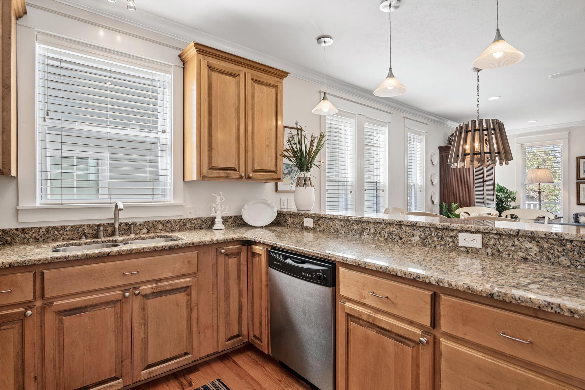 22 Moonlight Beach Lane Inlet Beach, FL 32461 - Photo 9 of 45 a kitchen with granite countertop a sink a window stainless steel appliances and cabinets