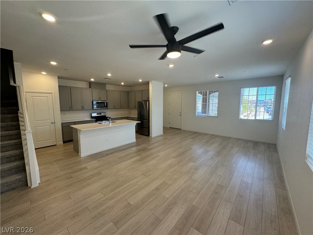 2821 Alcobaca Street Henderson, NV 89044 - Photo 3 of 24 An open-concept living space with a modern kitchen island and elegant flooring awaits.
