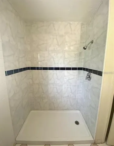 a bathroom with a shower and a bathtub