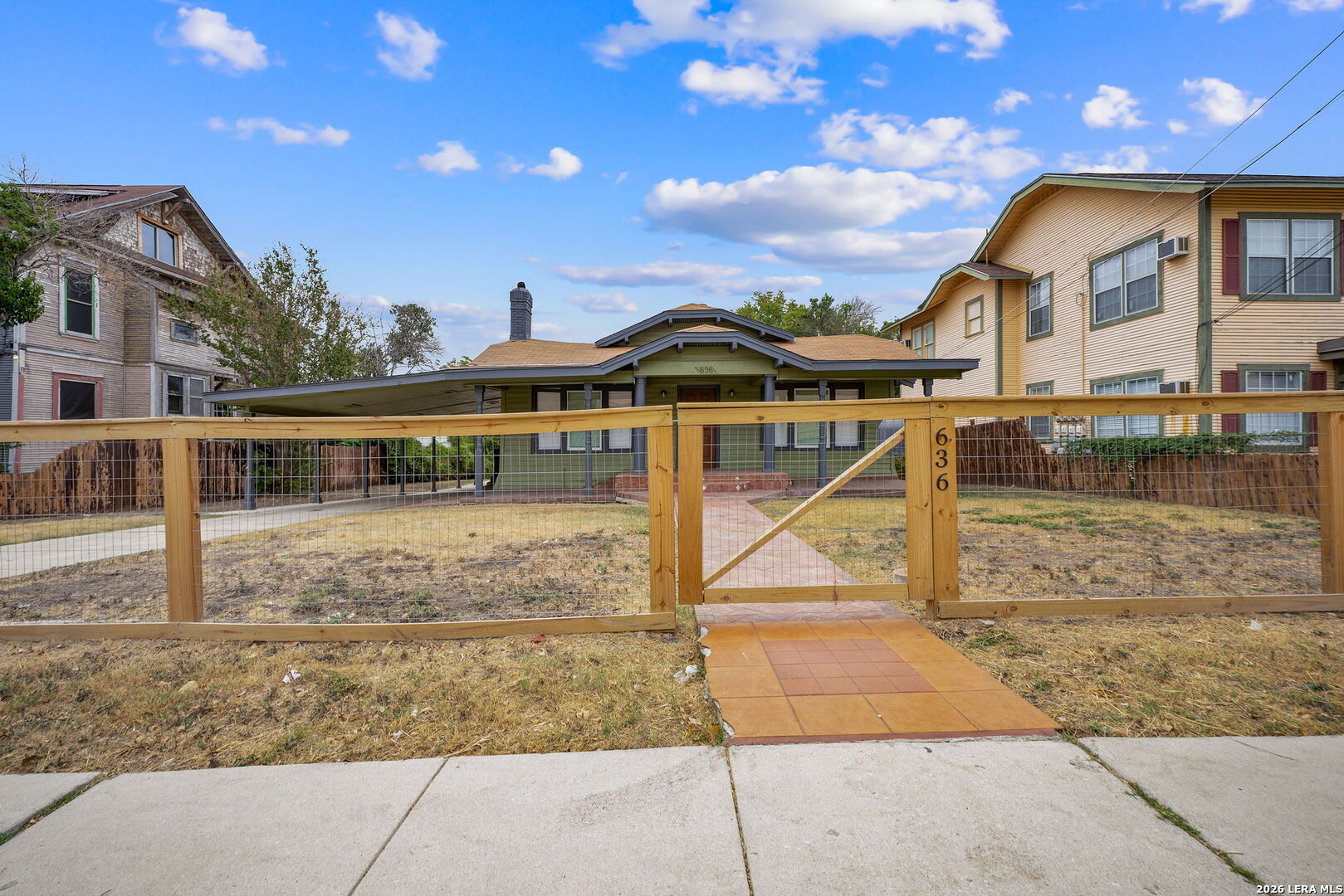 636 Rigsby Avenue San Antonio, TX 78210 - Photo 2 of 23 a view of a house with a yard