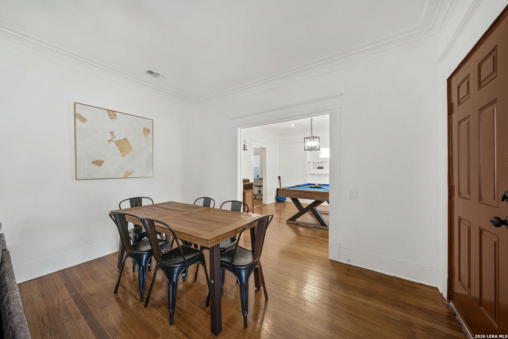 636 Rigsby Avenue San Antonio, TX 78210 - Photo 4 of 23 a view of a dining room with furniture and wooden floor