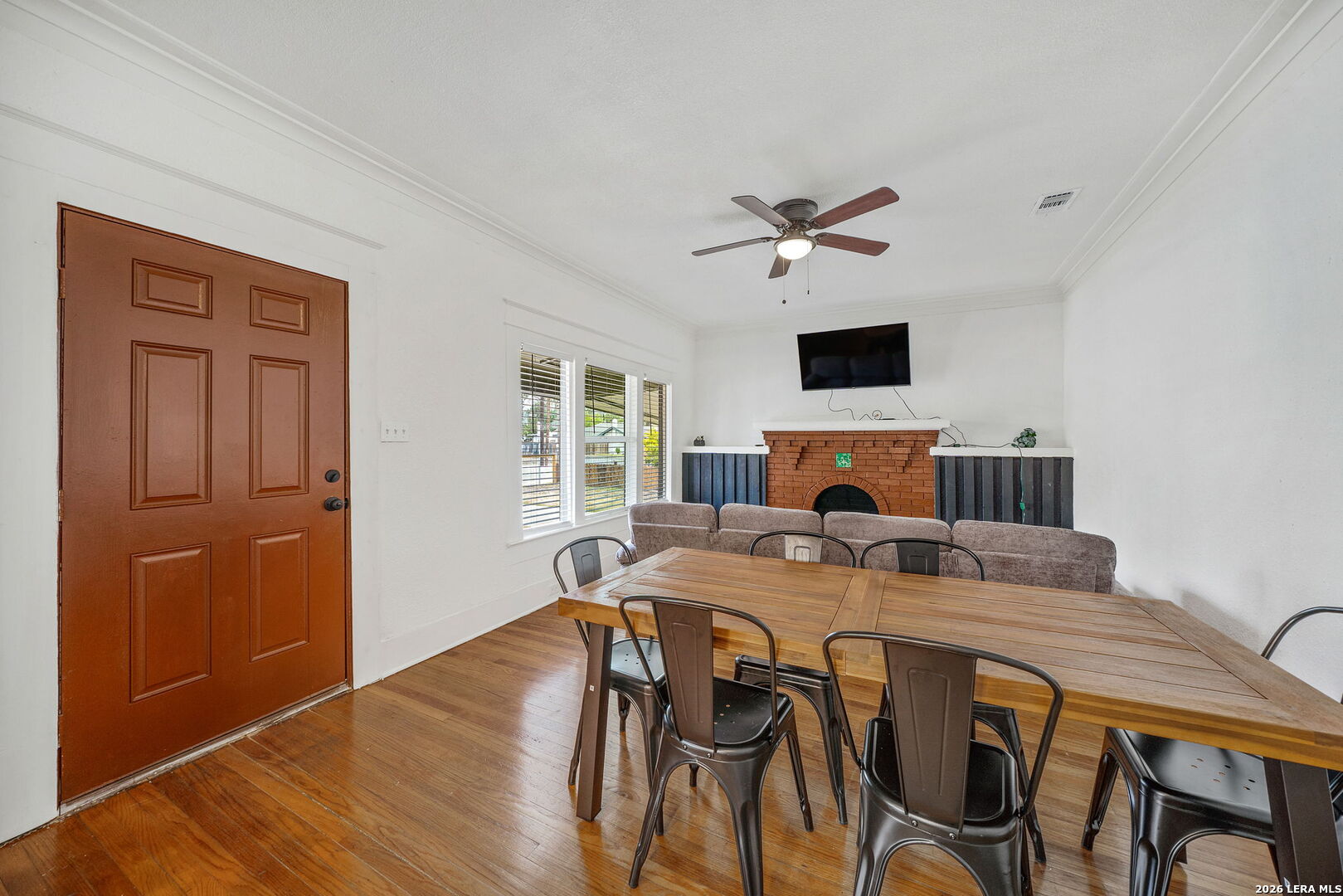 636 Rigsby Avenue San Antonio, TX 78210 - Photo 5 of 23 a view of a dining room with furniture window and wooden floor