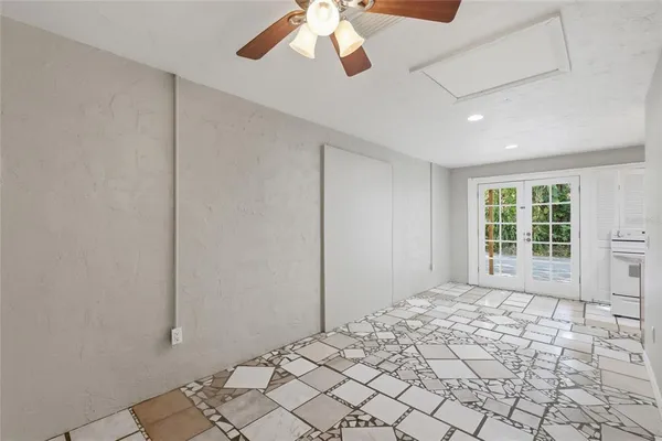 a kitchen with granite countertop a sink stove and refrigerator