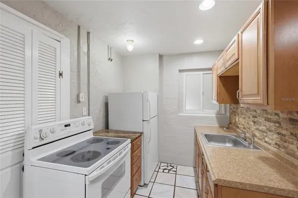 a bathroom with a toilet a sink and a mirror
