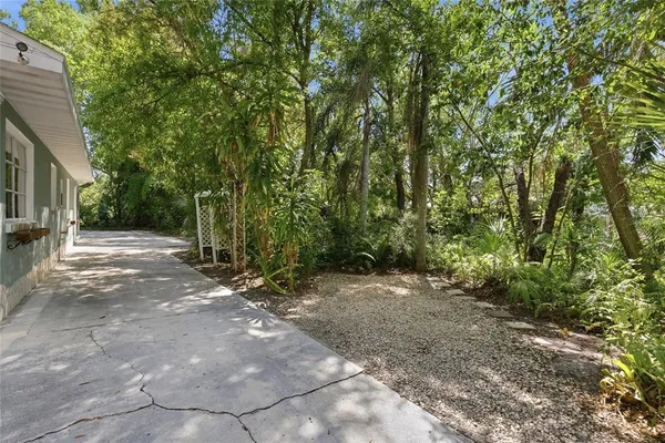 a backyard of a house with lots of green space