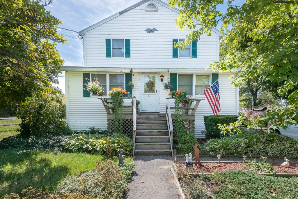 62 Beach Road Salisbury, MA 01952 - Photo 1 of 20 a front view of a house with garden
