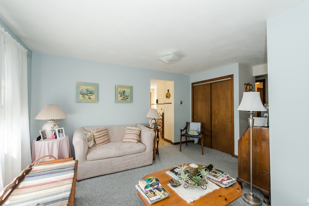 62 Beach Road Salisbury, MA 01952 - Photo 13 of 20 a living room with furniture and a lamp
