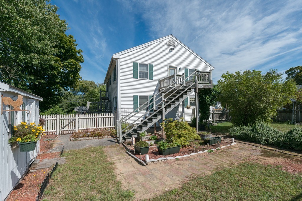 62 Beach Road Salisbury, MA 01952 - Photo 2 of 20 a front view of a house with garden