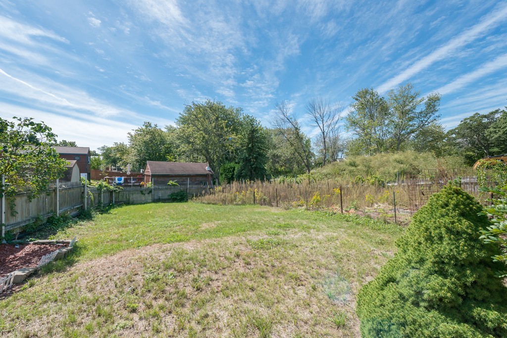 62 Beach Road Salisbury, MA 01952 - Photo 3 of 20 a backyard of a house with a garden and plants