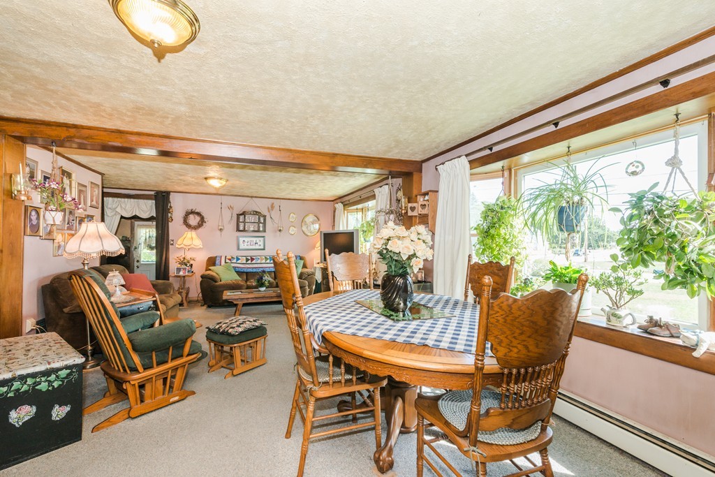 62 Beach Road Salisbury, MA 01952 - Photo 7 of 20 a dining room with furniture and wooden floor