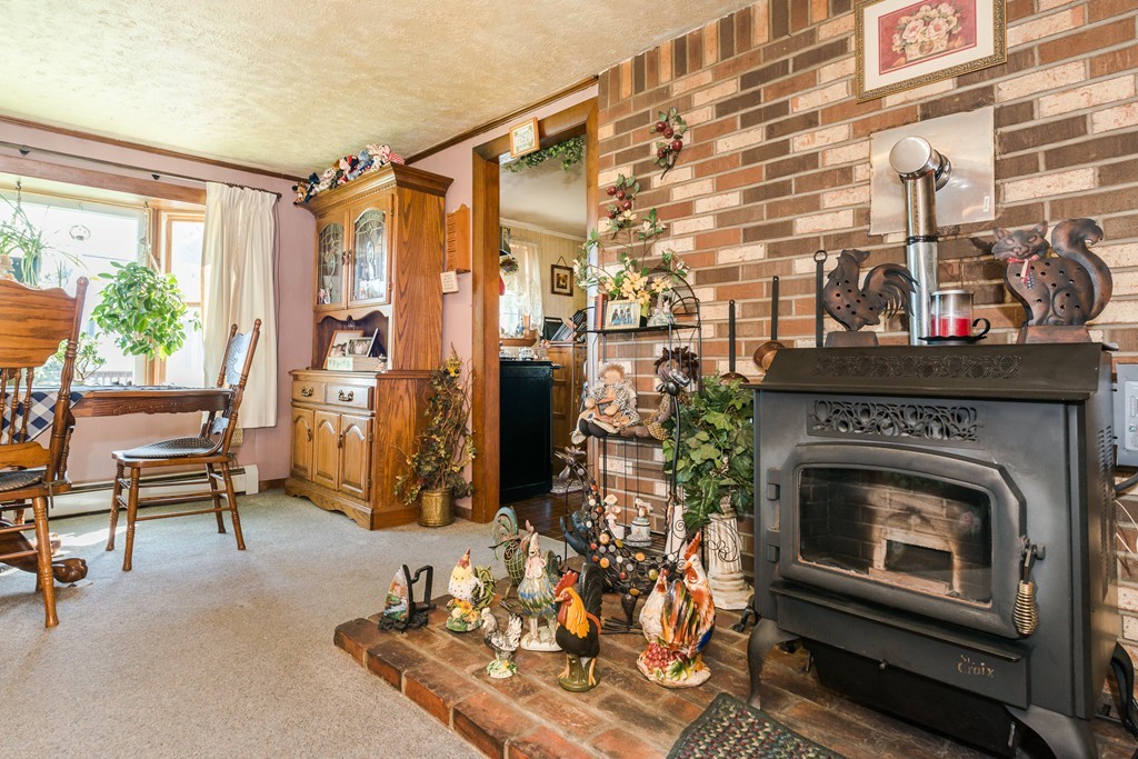 62 Beach Road Salisbury, MA 01952 - Photo 8 of 20 a living room with furniture and a fireplace