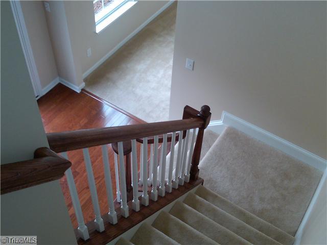 3148 Cranberry Ridge Drive High Point, NC 27265 - Photo 2 of 10 Entry. Two story Foyer features open staircase with railing and painted baluster, hardwood bullnose first tread with volute handrail.