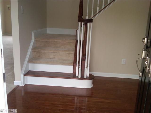 3148 Cranberry Ridge Drive High Point, NC 27265 - Photo 3 of 10 Entry. Hardwood bullnose first tread with volute handrail.