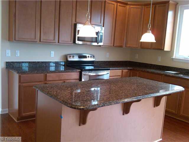 3148 Cranberry Ridge Drive High Point, NC 27265 - Photo 5 of 10 Kitchen. Another view of gleaming granite countertops and stainless appliances!