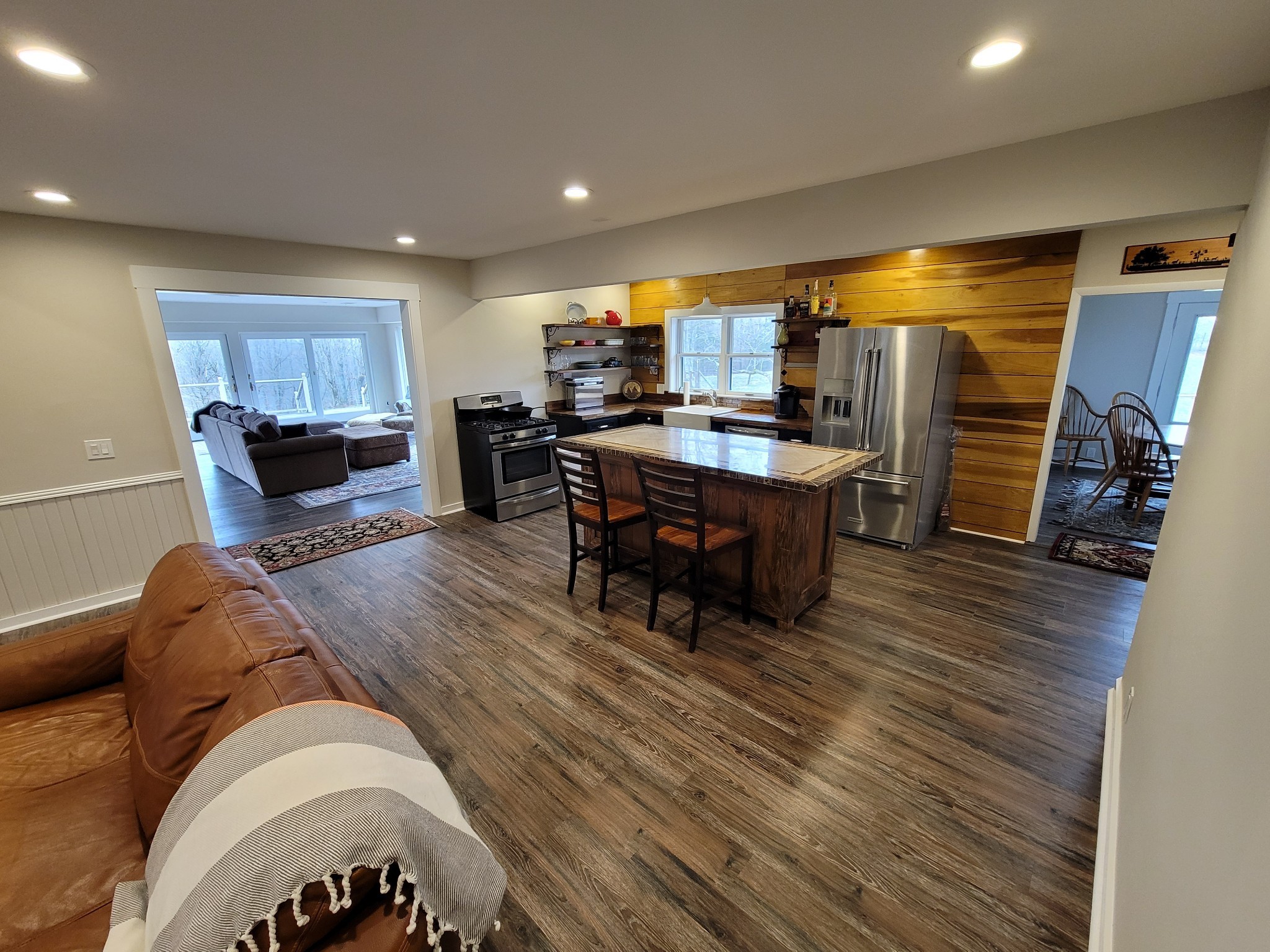 3111 Lewis Road Santa Fe, TN 38482 - Photo 15 of 40 a living room with a couch and a dining table with wooden floor