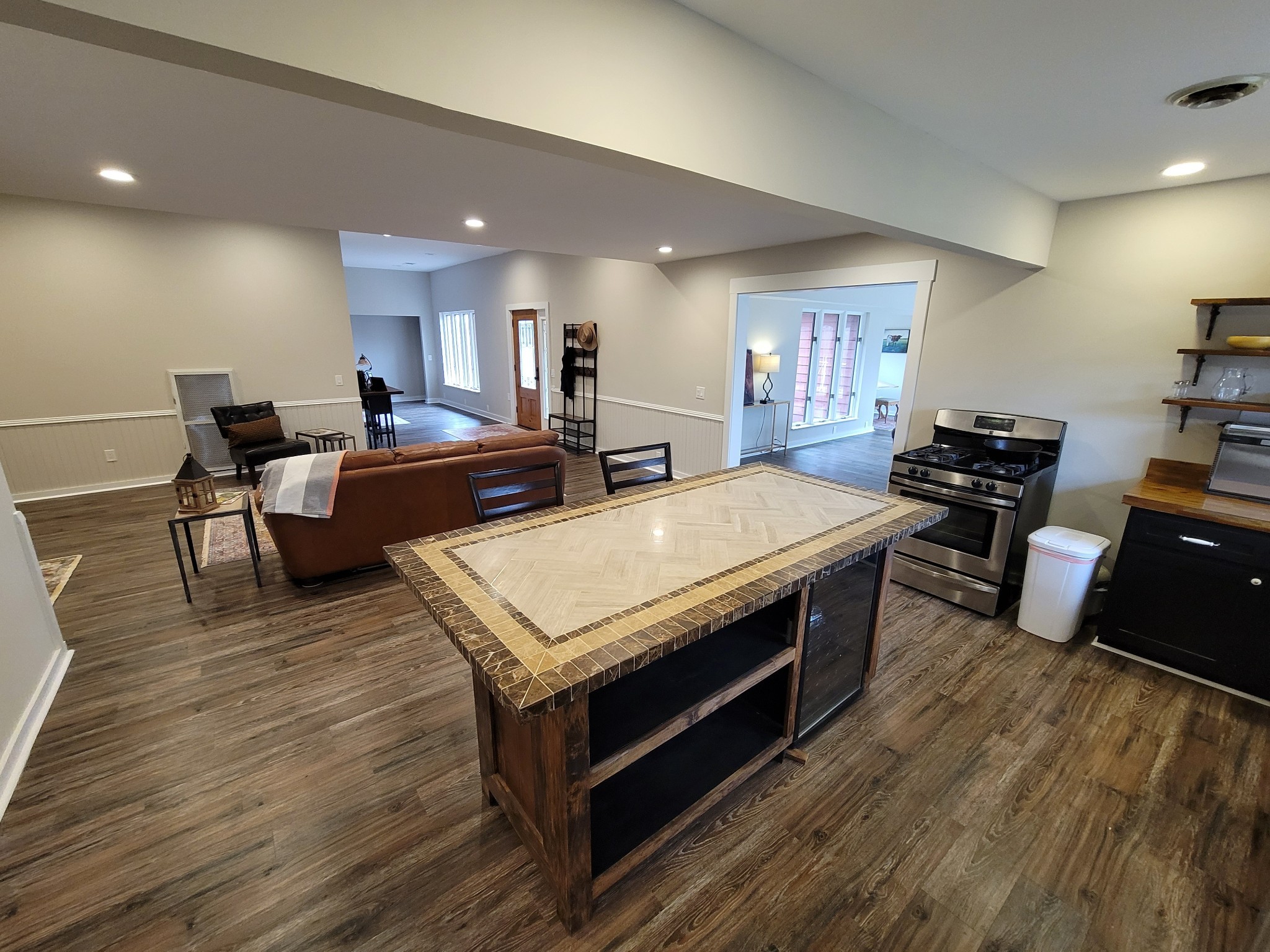 3111 Lewis Road Santa Fe, TN 38482 - Photo 9 of 40 a large kitchen with stainless steel appliances a stove a table and chairs in it