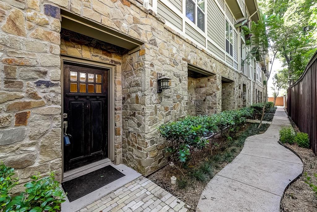 5914 Hudson Street, Unit 3 Dallas, TX 75206 - Photo 1 of 1 a front view of a house with a garden