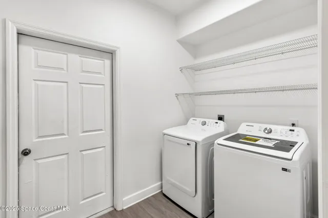 a utility room with dryer and washer
