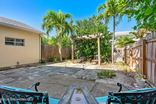 a backyard of a house with seating space