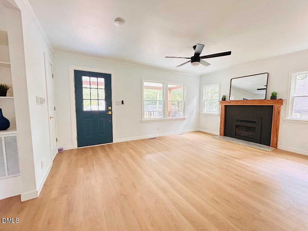 1606 James Street Durham, NC 27707 - Photo 15 of 24 a bedroom with a bed and wooden floor